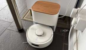 Switchbot smart robot vacuum being shown at charging dock