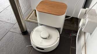 Switchbot smart robot vacuum being shown at charging dock