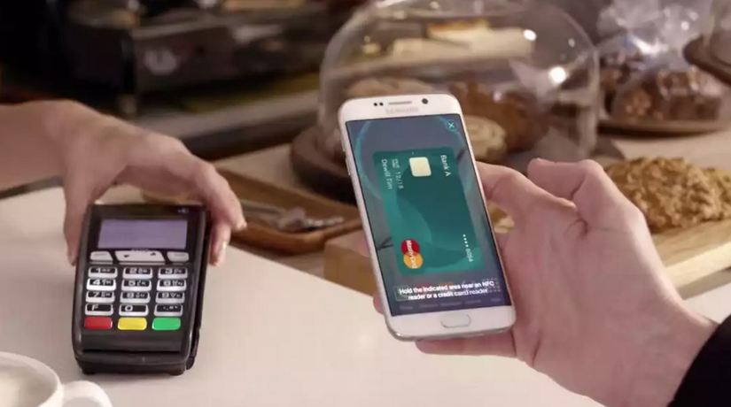 Samsung Pay card on Samsung phone near an ATM card reader