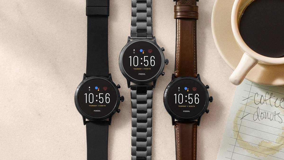 fossil gen 5 smartwatches on table next to coffee mug