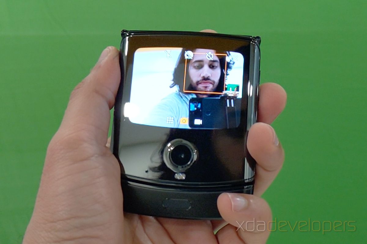 Taking a selfie with the Motorola Razr's small outside screen.