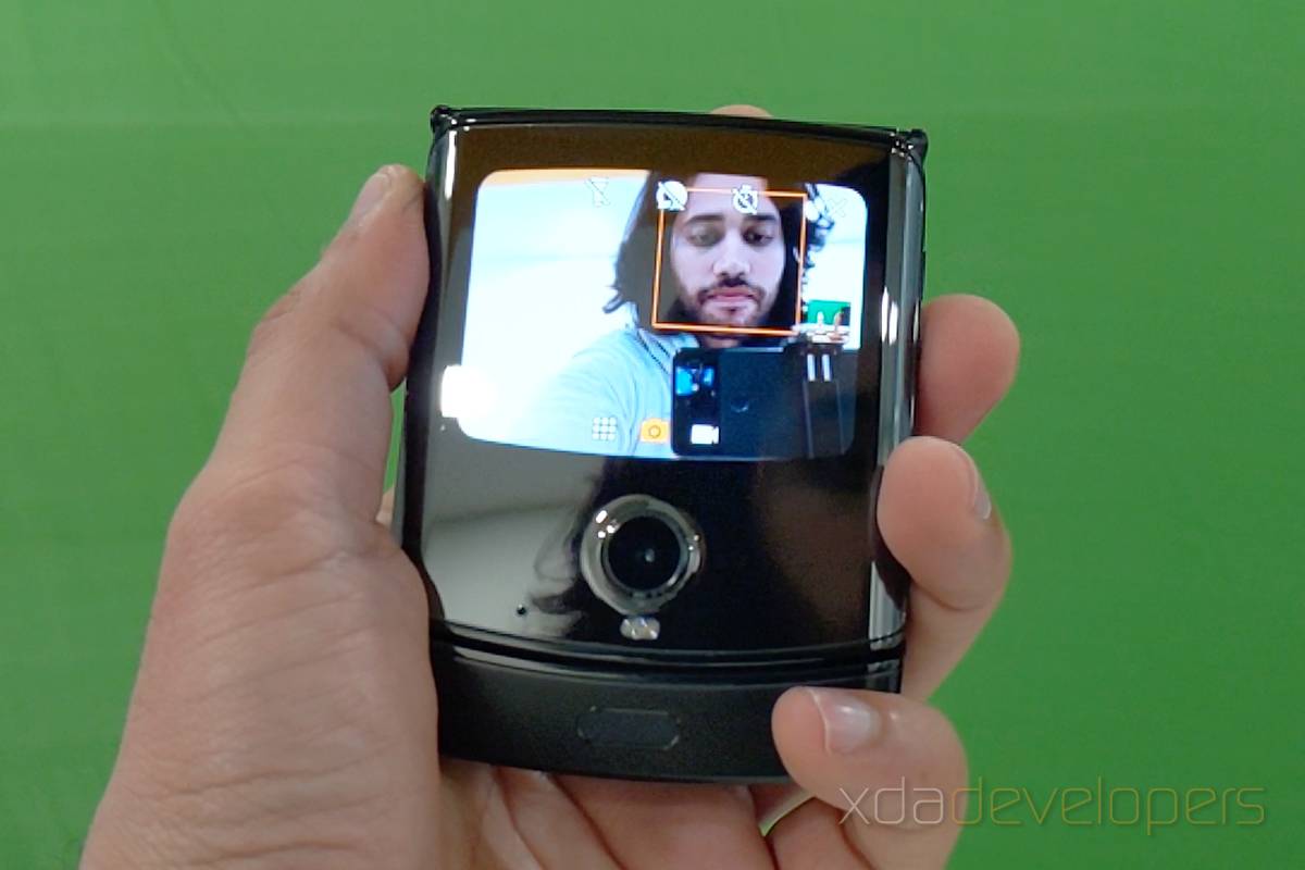 Taking a selfie with the Motorola Razr's small outside screen.