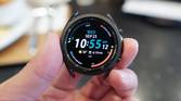 Samsung Galaxy Watch 3 held in a hand with the time and other complications.