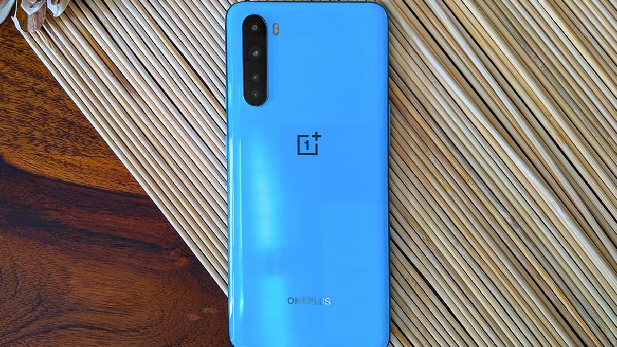 Blue OnePlus Nord on wood grain background