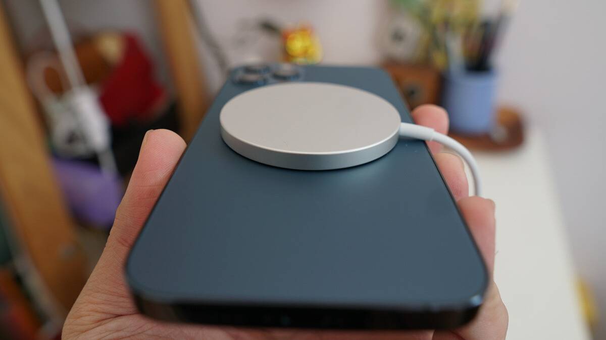 iPhone 12 Pro with a MagSafe charger attached.