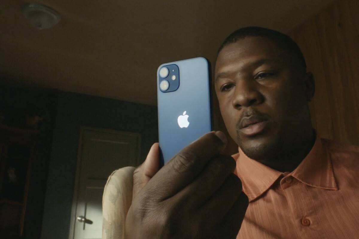 iPhone 12 Mini looking very small in the hands of a consumer.