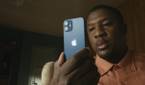 iPhone 12 Mini looking very small in the hands of a consumer.
