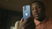 iPhone 12 Mini looking very small in the hands of a consumer.