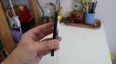 side profile of Apple MagSafe charger connected to the iPhone 12