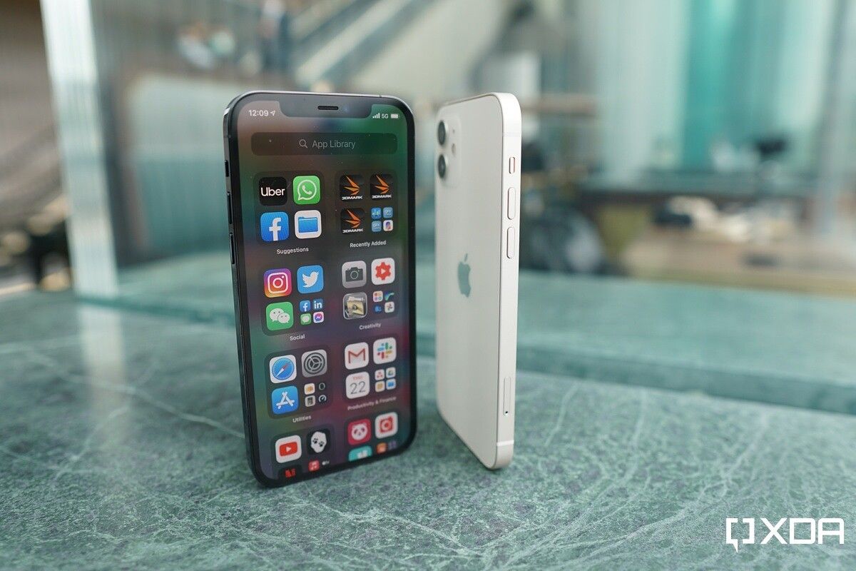 Apple iPhone 12 White with its back visible and the Apple iPhone 12 Pro Pacific Blue Screen Facing