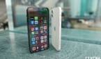 Apple iPhone 12 White with its back visible and the Apple iPhone 12 Pro Pacific Blue Screen Facing
