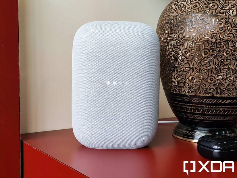 Google-Nest-Audio-XDA-Chalk-on-red-table-besides-flower-vase