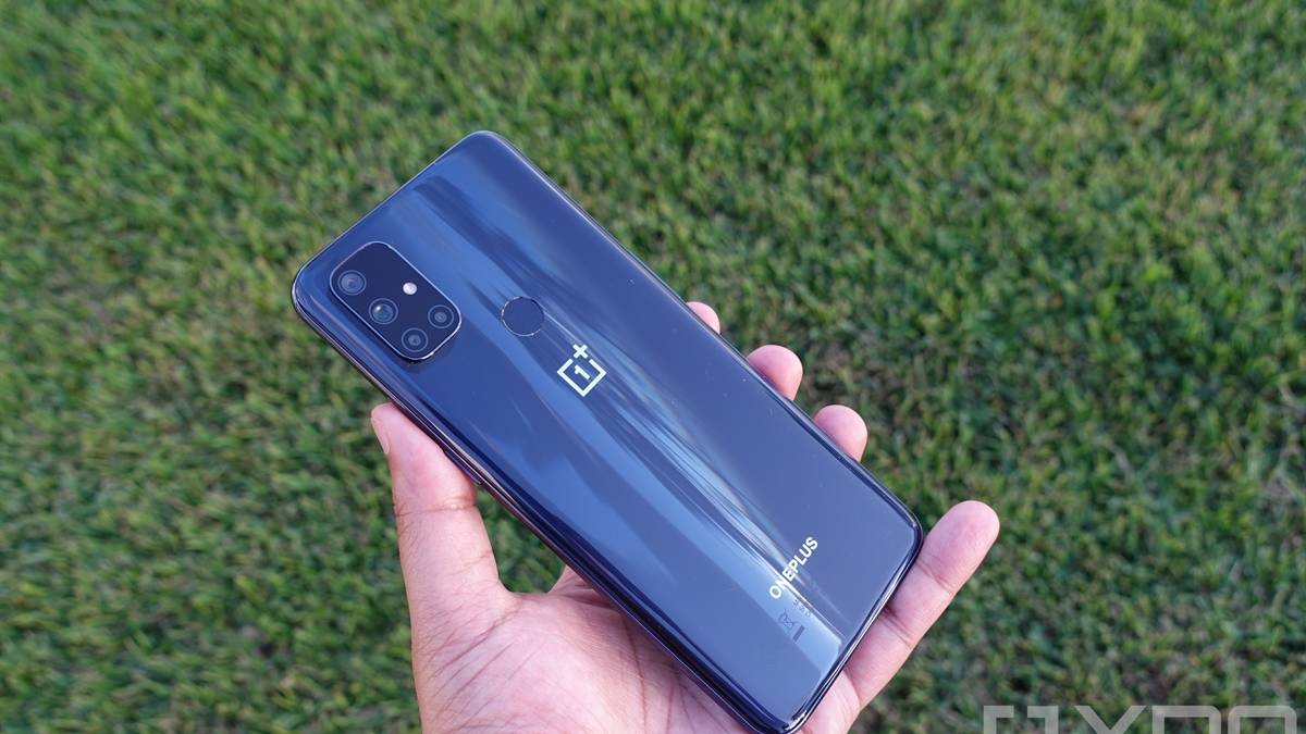 OnePlus Nord N10 5G in hand with grass in the background