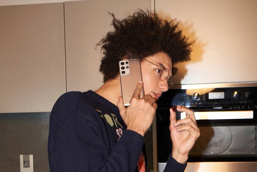 Someone talking on a Galaxy S21 Ultra