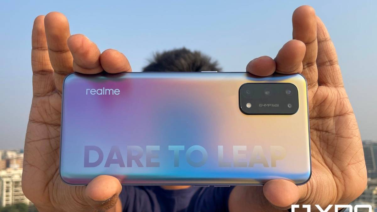 Realme X7 Pro held out in hand to highlight brandmark on phone back