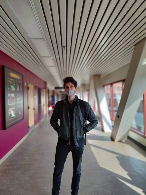Masked human standing and posing