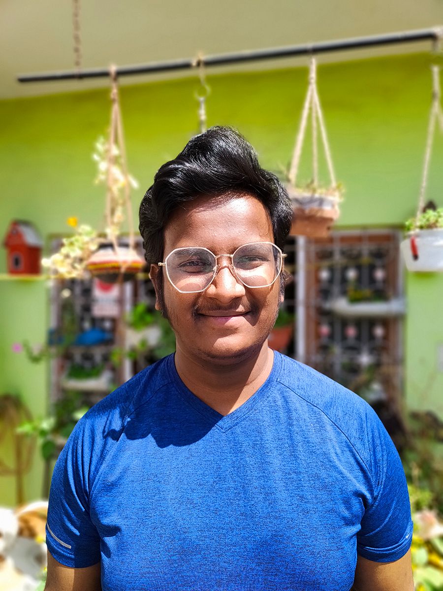 human portrait in front of plants clicked with Realme 8 Pro 108MP camera