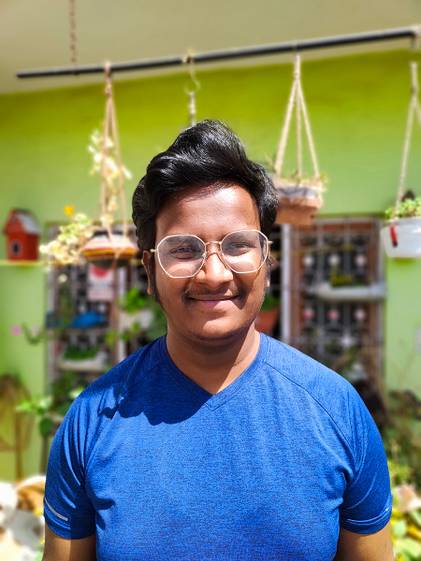 human portrait in front of plants clicked with Realme 8 Pro 108MP camera