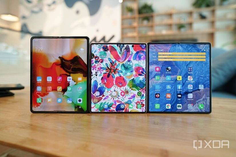 The Xiaomi Mi Mix Fold next to the Samsung Galaxy Z Fold 2 and the Huawei Mate X2 on top of a table in unfolded form. 