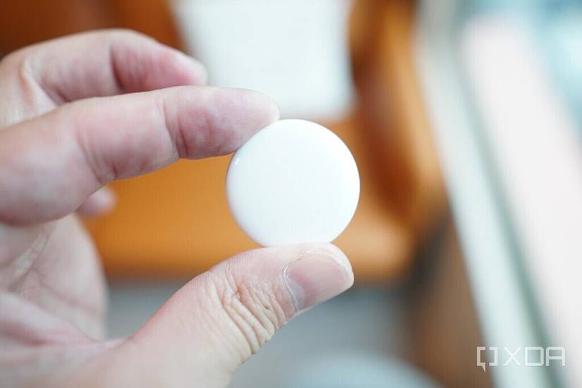 An AirTag's plastic back.