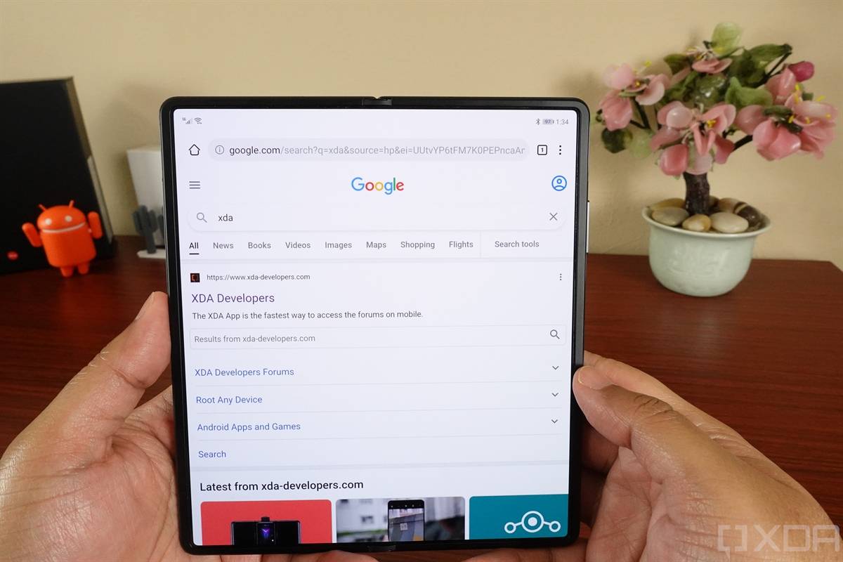 Huawei Mate X2 held with both hands