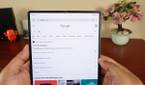 Huawei Mate X2 held with both hands