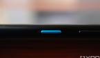 Close-up shot of the blue power button on the ASUS ZenFone 8