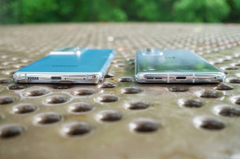 Galaxy S21 Ultra on the left and OnePlus 9 Pro on the right lying flat