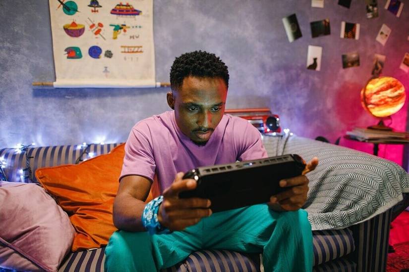 Man playing on the One X Player at home