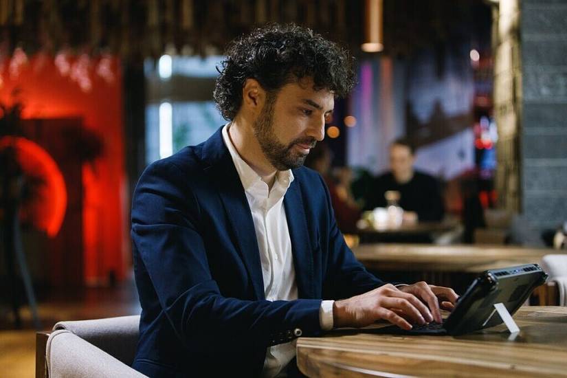 Man using One X Player in a restaurant