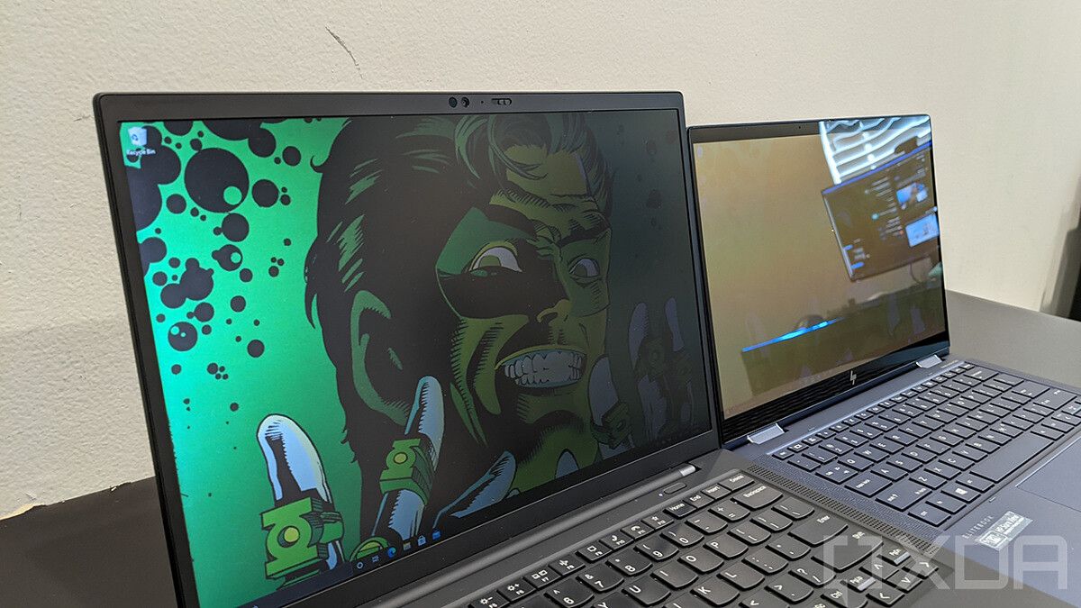 ThinkPad X1 Carbon next to HP Elite Dragonfly with privacy display on