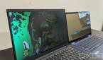 ThinkPad X1 Carbon next to HP Elite Dragonfly with privacy display on