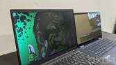 ThinkPad X1 Carbon next to HP Elite Dragonfly with privacy display on