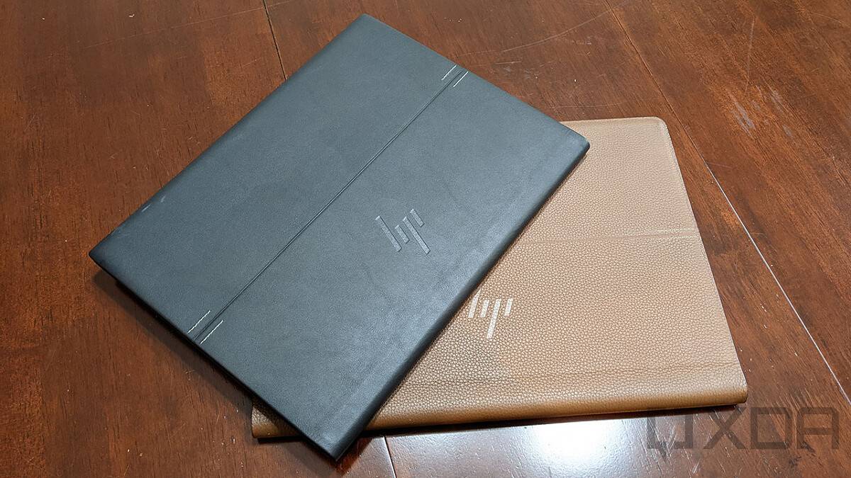 Black Elite Folio on top of brown Spectre Folio