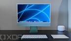 Front view of 24-inch iMac in green with keyboard and trackpad