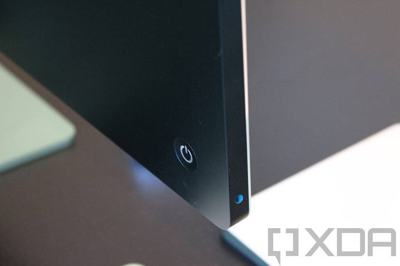 Close-up of power button and 3.5mm audio jack on 24-inch iMac