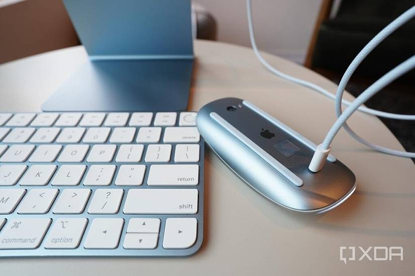 The Magic Mouse's charging port is at the bottom