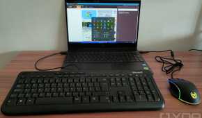 A USB keyboard and mouse plugged into a laptop running Windows 11