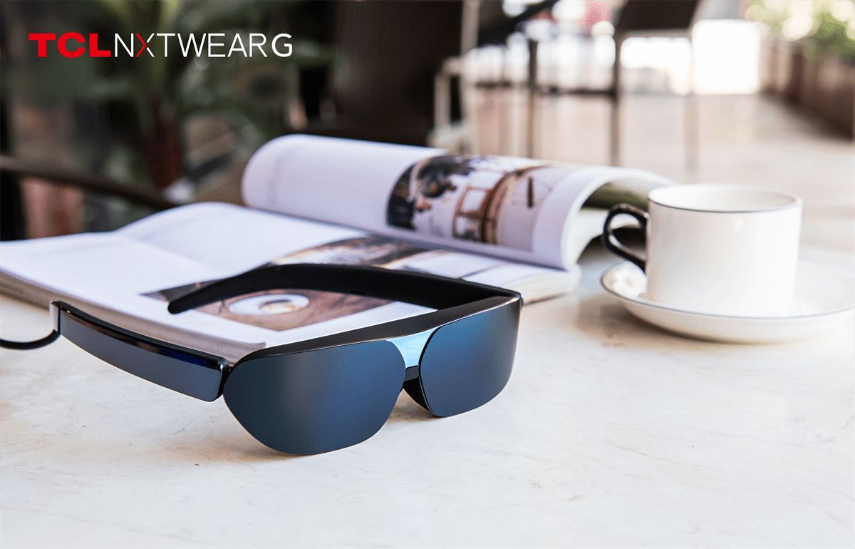 TCL NXTWEAR G glasses sitting on a table
