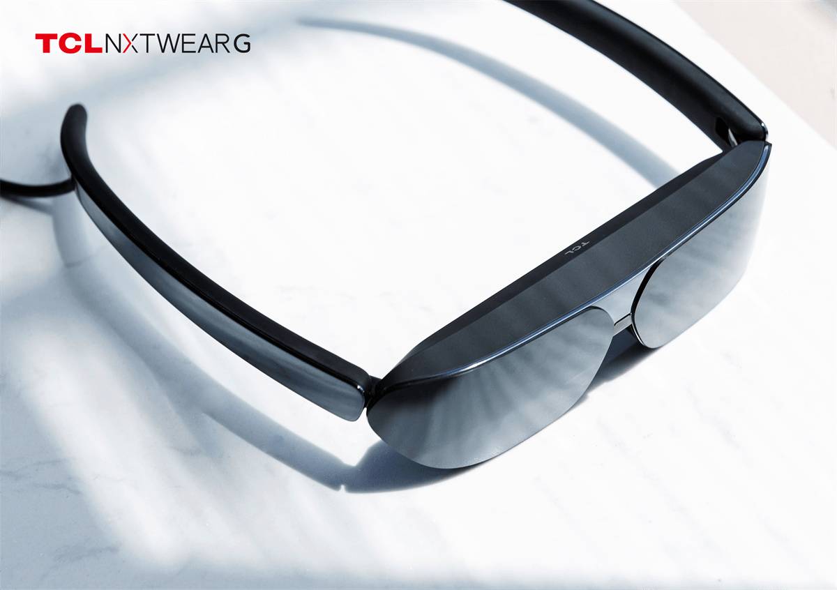 TCL NXTWEAR G glasses sitting on a table