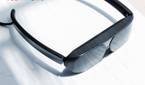 TCL NXTWEAR G glasses sitting on a table