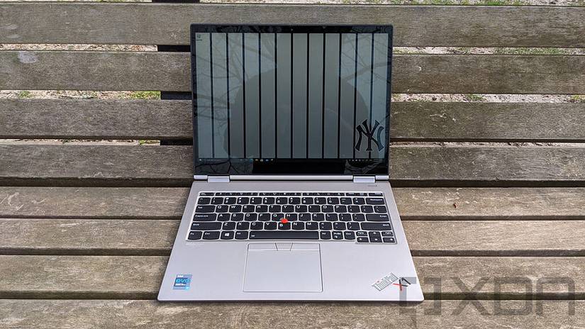 Front view of ThinkPad X1 Titanium Yoga on wooden bench