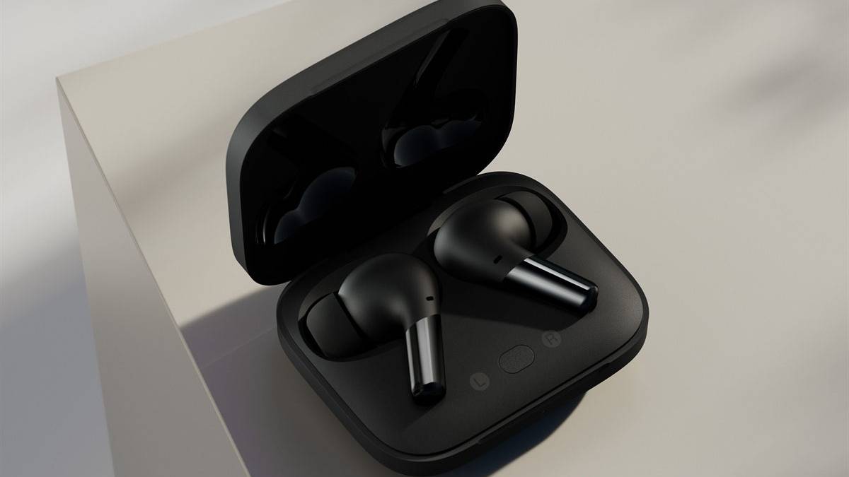Black OnePlus Buds Pro in case on white table