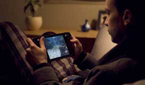 A man playing Doom on a Steam Deck