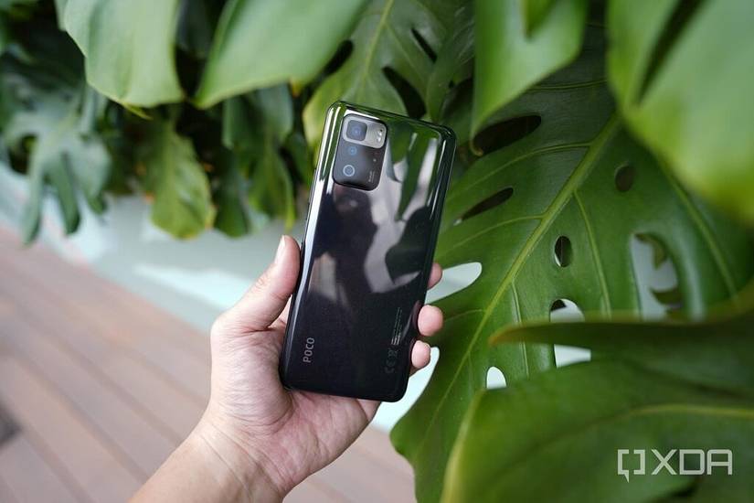 the POCO X3 GT in the hand.