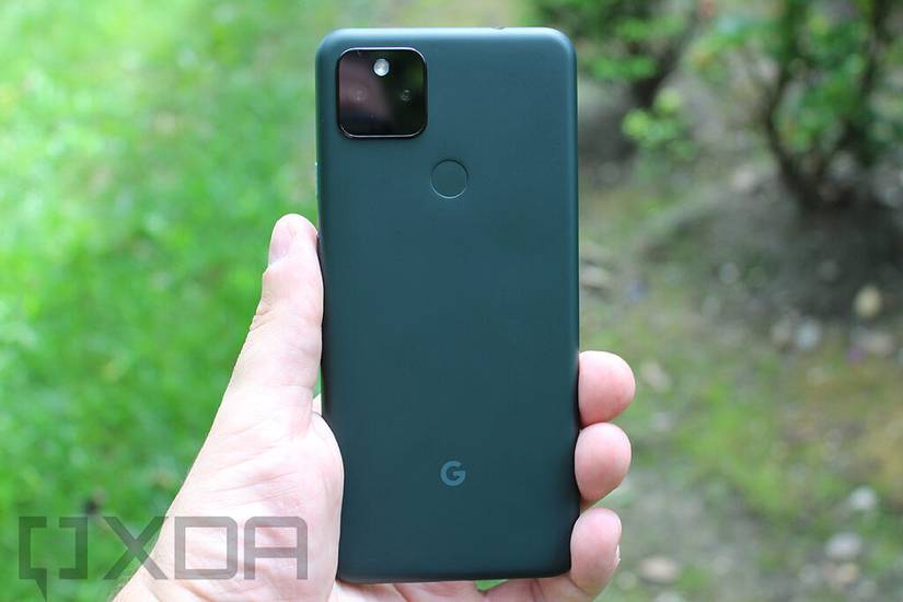 Hand holding Mostly Black Google Pixel 5a