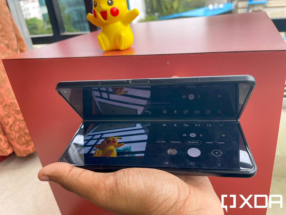 Samsung Galaxy Z Fold 3 in Flex Mode being used to take a photo of a toy from an awkward angle