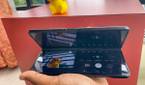 Samsung Galaxy Z Fold 3 in Flex Mode being used to take a photo of a toy from an awkward angle