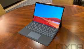 Surface Pro X in black on wooden table