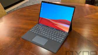 Surface Pro X in black on wooden table